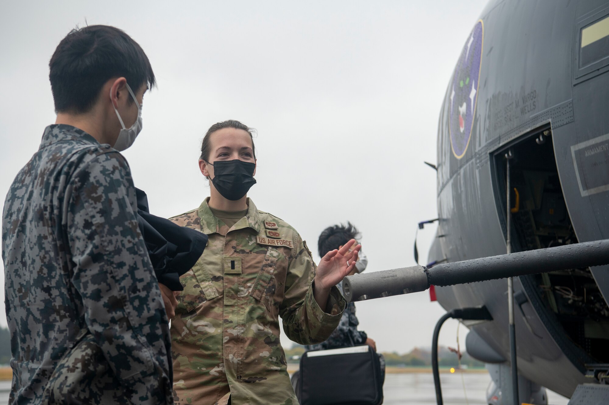 U.S. Air Force 1st Lt. Megan Nobuoka, 27th Special Operation Aircraft Maintenance Squadron maintenance lead, brief a Japan Air Self-Defense Force member about AC-130J Ghostrider capabilities at Yokota Air Base, Japan, Nov. 15, 2022.