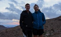 U.S. Marine Capt. Kyle King, the assistant operations officer with 3rd Battalion, 11th Marine Regiment, 1st Marine Division, and Hope Sweetnam, King’s partner, pose for a photo after an evening run in Yucca Valley, California, Nov. 8, 2022. King is the first active-duty Marine to win the Marine Corps Marathon since 1983. The Marine Corps Marathon promotes physical fitness, generates community goodwill, and showcases the organizational skills of the Marine Corps.