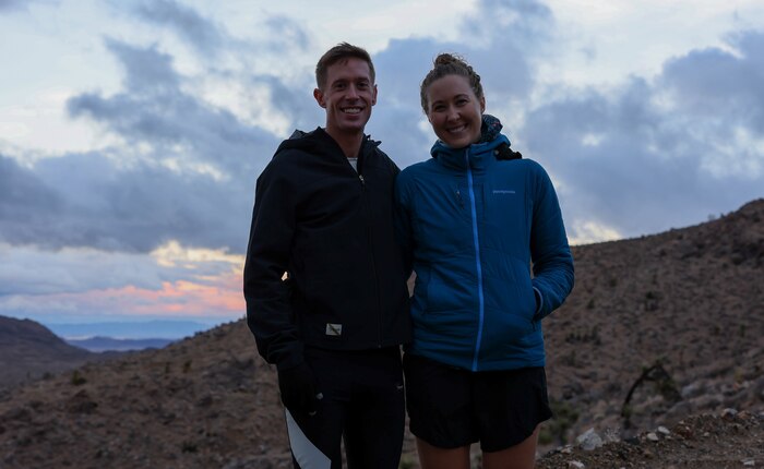 U.S. Marine Capt. Kyle King, the assistant operations officer with 3rd Battalion, 11th Marine Regiment, 1st Marine Division, and Hope Sweetnam, King’s partner, pose for a photo after an evening run in Yucca Valley, California, Nov. 8, 2022. King is the first active-duty Marine to win the Marine Corps Marathon since 1983. The Marine Corps Marathon promotes physical fitness, generates community goodwill, and showcases the organizational skills of the Marine Corps.