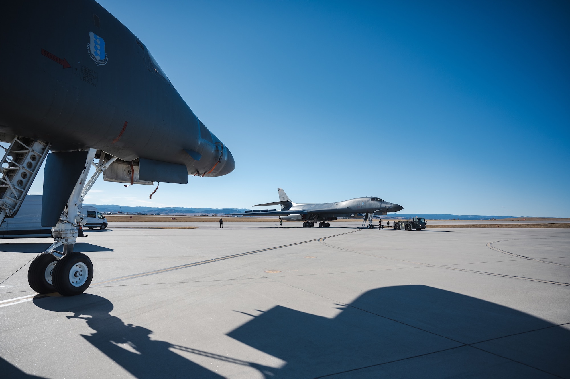 Airmen from the 28th Aircraft Maintenance Squadron, tow a B-1B Lancer to a weapons loading pad in preparation for a Weapon System Evaluation program, at Ellsworth Air Force Base, S.D., Nov. 7, 2022.