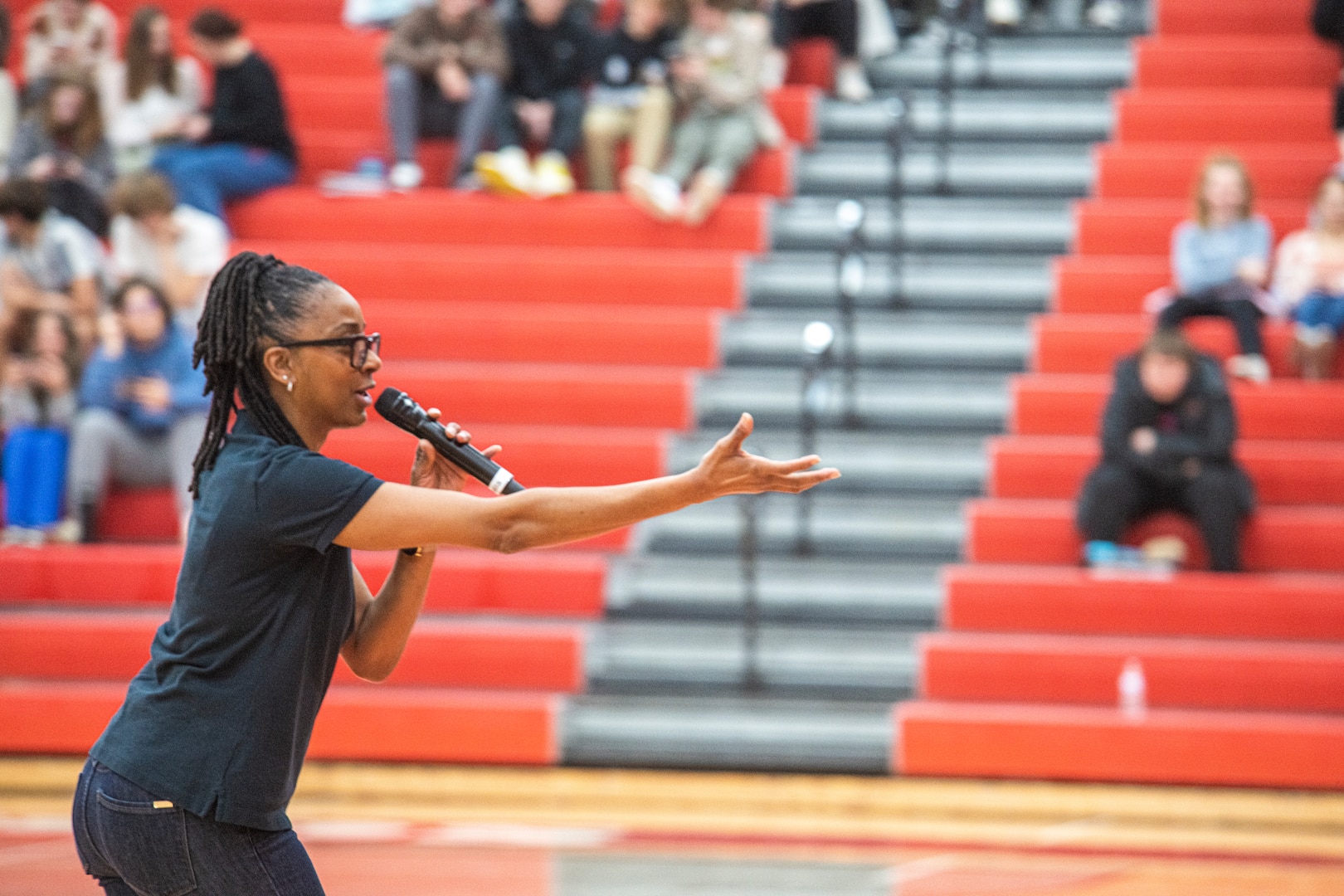 U.S. Air Force Tech. Sgt. (Ret.) Felika LaRock, Flight One vocalist from Band of Flight, Wright-Patterson Air Force Base, Ohio, sings to the audience at Holly High School, Michigan