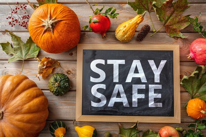 pumpkins and squash surround the words STAY SAFE