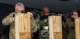 Attachés Brig. Gen. Michael Shapland, of New Zealand; Capt. Malick Ndiaye, of Senegal; and Rear Adm. Axel Ristau, of Germany, fire at targets on a range simulator at Fort Indiantown Gap’s Training Support Center Nov. 16 during Defense Intelligence Agency’s Fall 2022 Operations Orientation Program tour of Pennsylvania National Guard facilities here. (Pennsylvania National Guard photo by Wayne V. Hall)