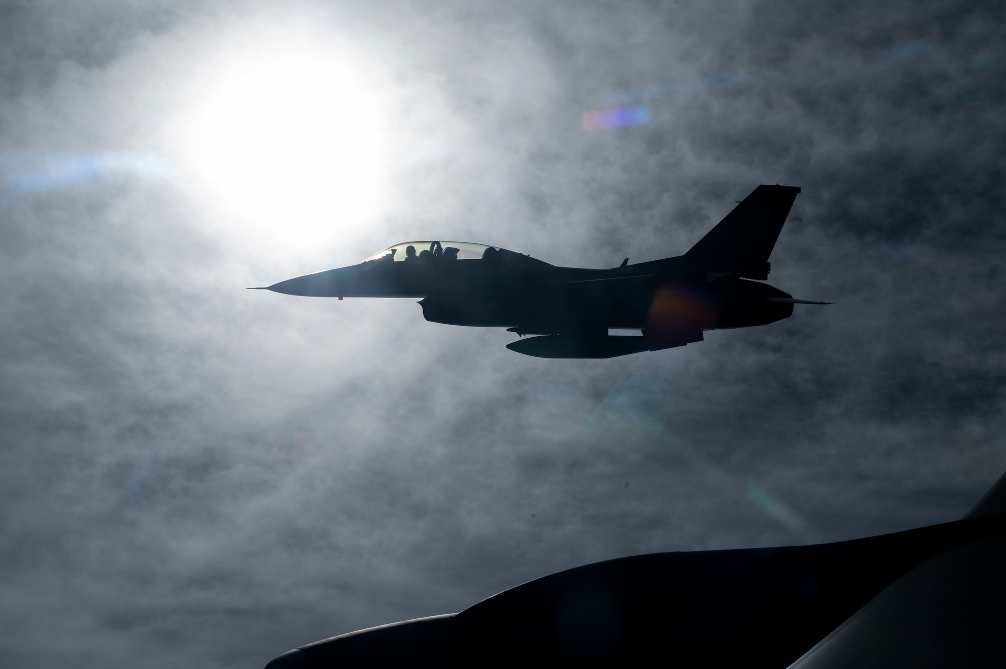 An F-16 Viper from the 314th Fighter Squadron at Holloman Air Force Base, New Mexico, flies next to a KC-135 Stratotanker from the 121st Air Refueling Wing at Rickenbacker Air National Guard Base, Columbus, Ohio, over New Mexico, Nov. 15, 2022.