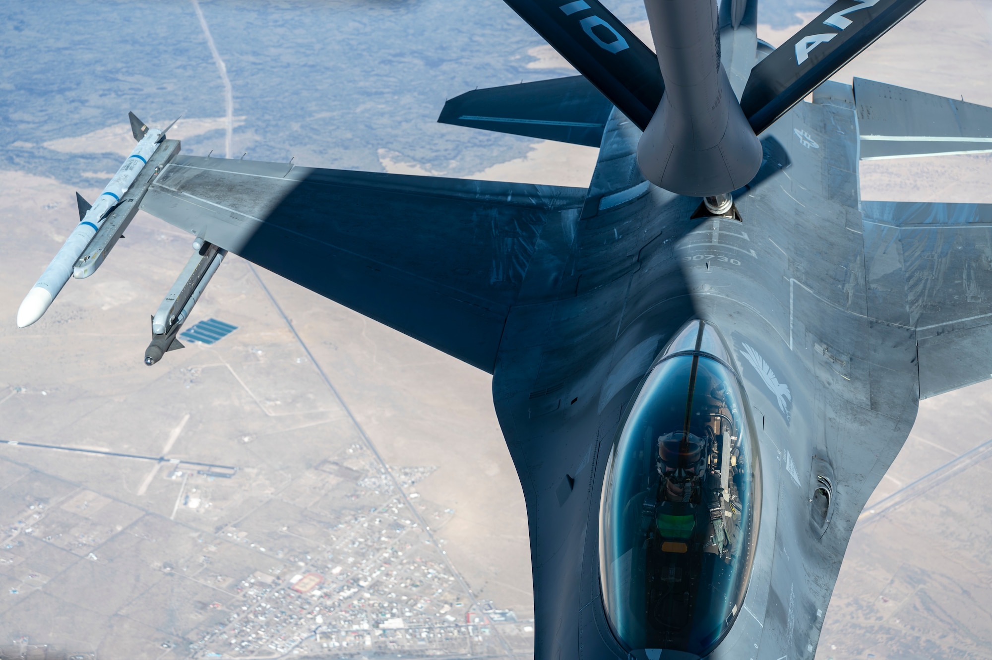 An F-16 Viper from the 314th Fighter Squadron at Holloman Air Force Base, New Mexico, is refueled by a KC-135 Stratotanker from the 121st Air Refueling Wing at Rickenbacker Air National Guard Base, Columbus, Ohio, over New Mexico, Nov. 15, 2022.