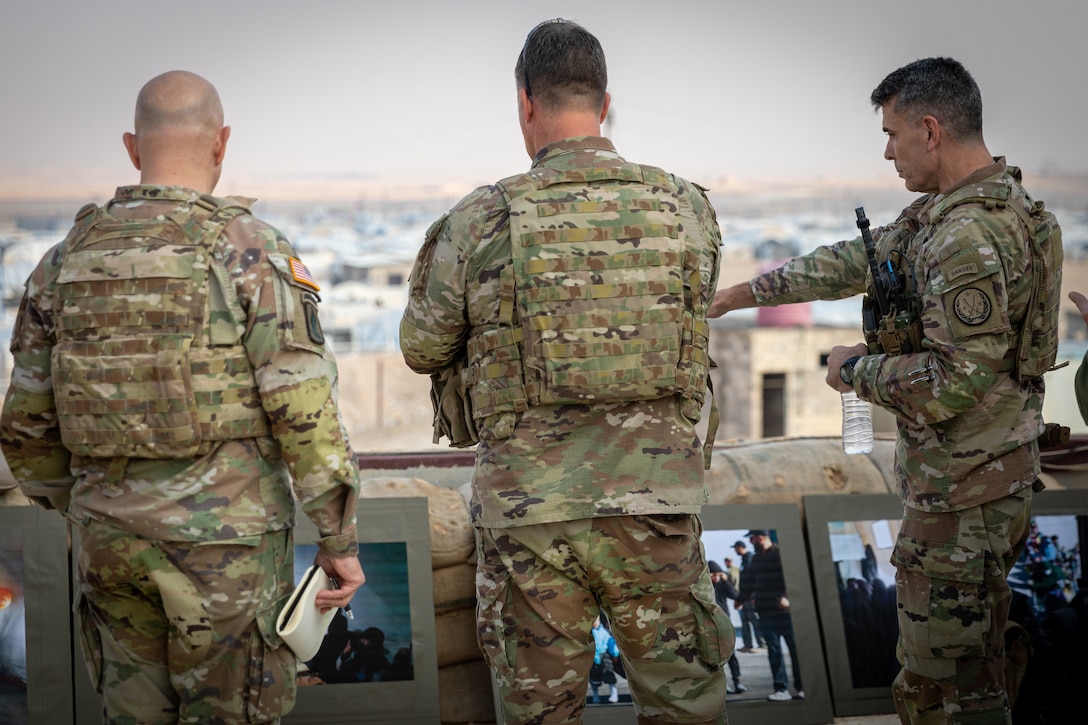 November 17: Colonel Mike Adamski, Executive Officer to the CENTCOM commander; General Michael “Erik” Kurilla, CENTCOM commander; and Major General Matt McFarlane, Commander of Combined Joint Task Force - Operation Inherent Resolve, inside the Al Hol camp for displaced persons, northeast Syria. In this image, the leaders stand at the headquarters of the camp administration overlooking the camp.