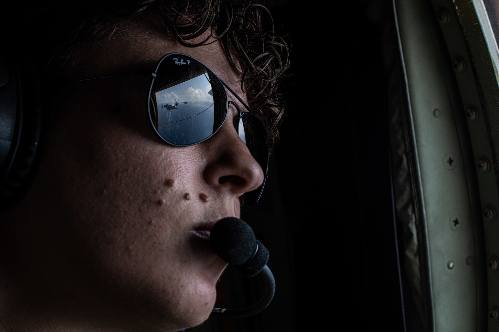 Airmen looks out window.