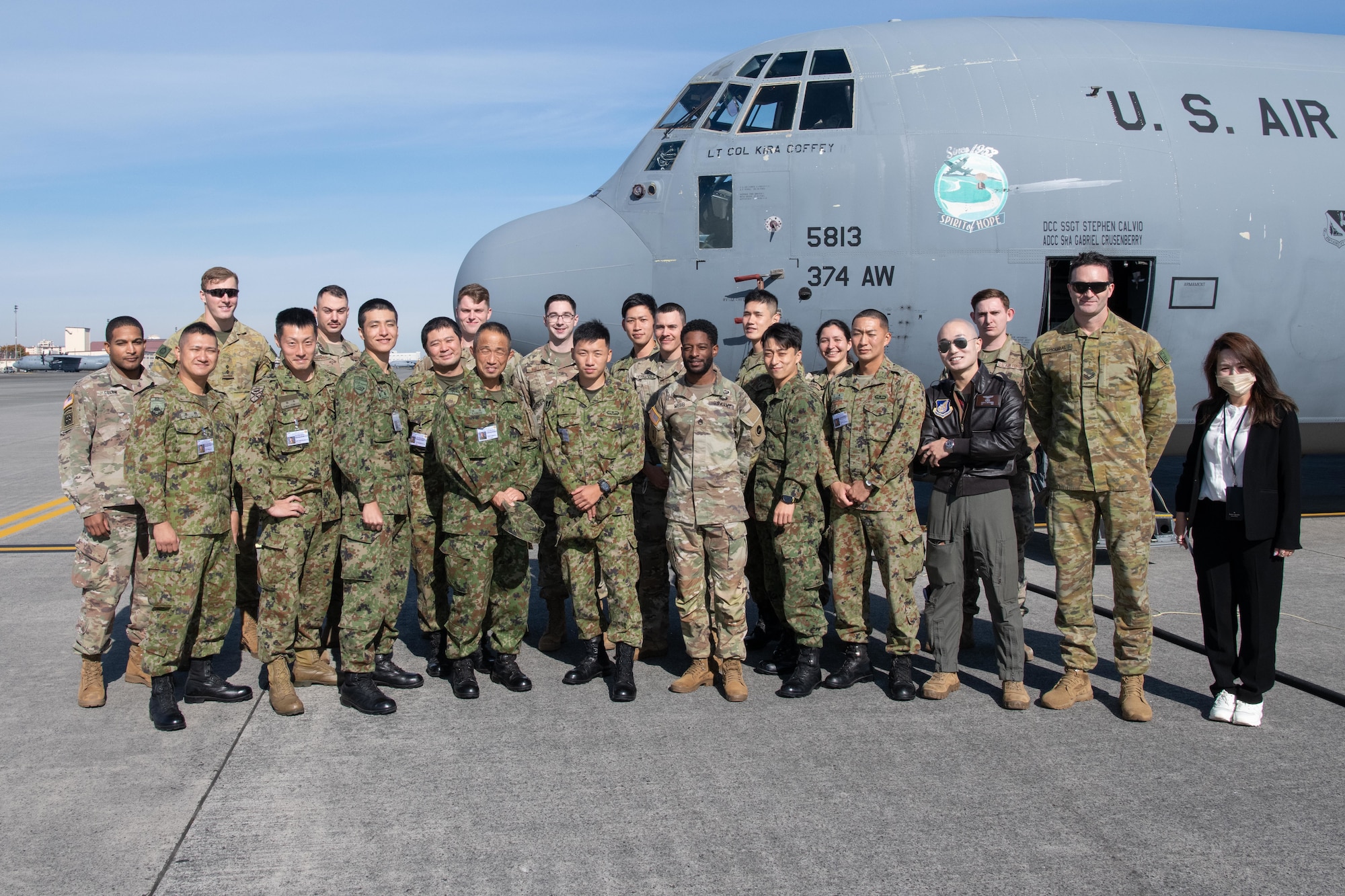 A group photo of members from the U.S. Military, Australian Army and Japanese Ground Self Defense Force.