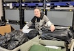 Emina Pecanin is a Logistics Readiness Center Wiesbaden Central Issue Facility supply technician, 405th Army Field Support Brigade. Pictured here, Pecanin sorts through CIF clothing and equipment at the Wiesbaden facility, Nov. 16, preparing it for turn-in to the Defense Logistics Agency in Kaiserslautern, Germany. Pecanin said making the decision to move from her home country of Croatia to Germany wasn’t easy, but five years later she’s glad she did. (U.S. Army Courtesy photo)