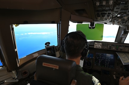 Capt. Jordan Gauvin, a pilot with the 157th Air Refueling Wing, Pease Air National Guard Base, New Hampshire Air National Guard, guides a KC-46A Pegasus over the Pacific Ocean during a 36-hour endurance mission, Nov. 16, 2022. The long-duration sortie took place Nov. 16-17 and was crewed by active duty and Air National Guard Airmen from Pease, who flew the jet nonstop from New Hampshire, across North America and the Pacific Ocean, around Guam, and home.