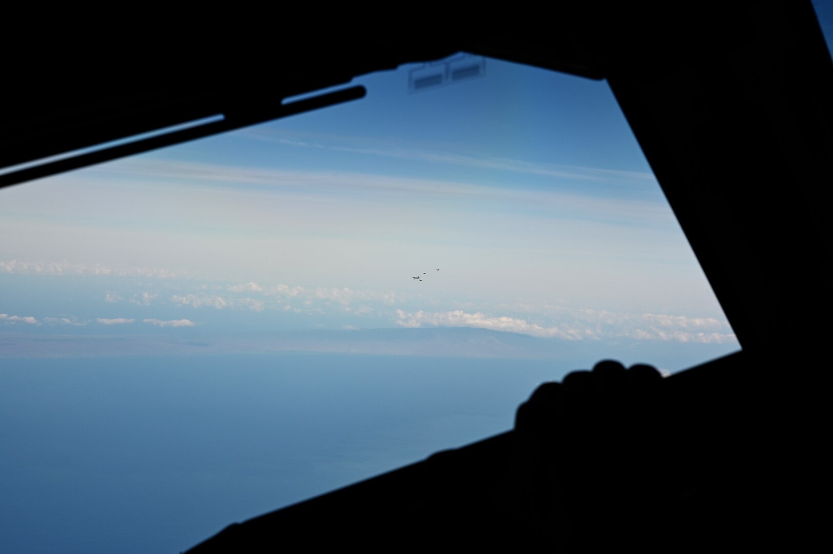 A KC-46A flies over the Pacific Ocean