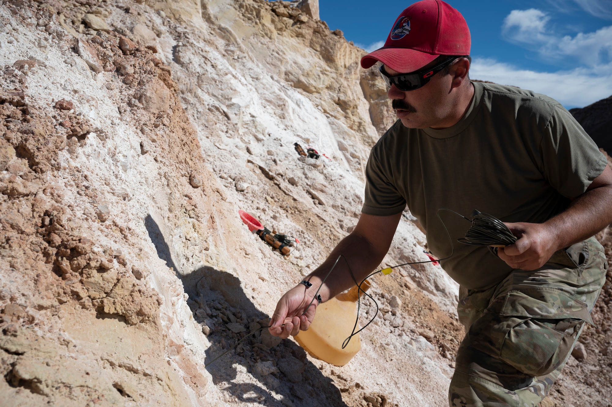 Man prepares dynamite for deployment