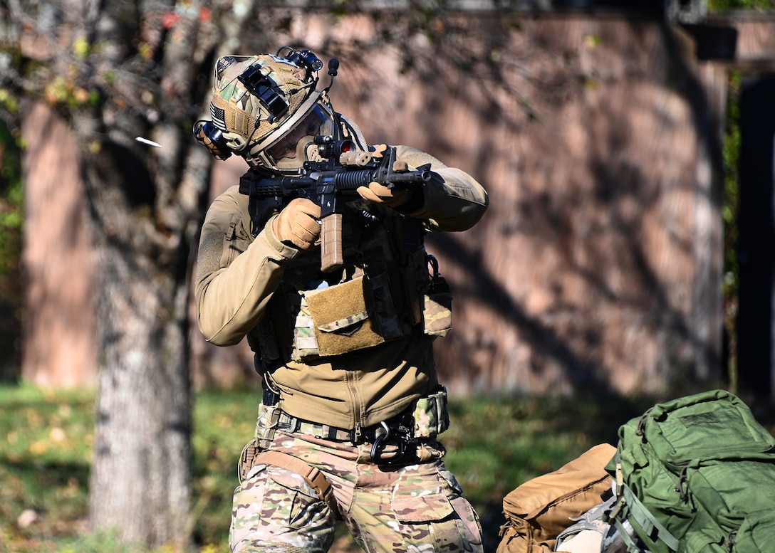 A 316th Security Forces Airman fires a weapon during Tactical Combat Casualty Care training at Joint Base Andrews, Md., Nov. 18, 2022.