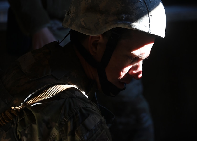 A 316th Security Forces Group Airman practices proper emergency care methods for a simulated victim during Tactical Combat Casualty Care training at Joint Base Andrews, Md., Nov. 18, 2022. The TCCC Training consisted of moving towards injured victims, then performing proper emergency care methods and evacuation by helicopter. (U.S. Air Force photo by Airman 1st Class Austin Pate)