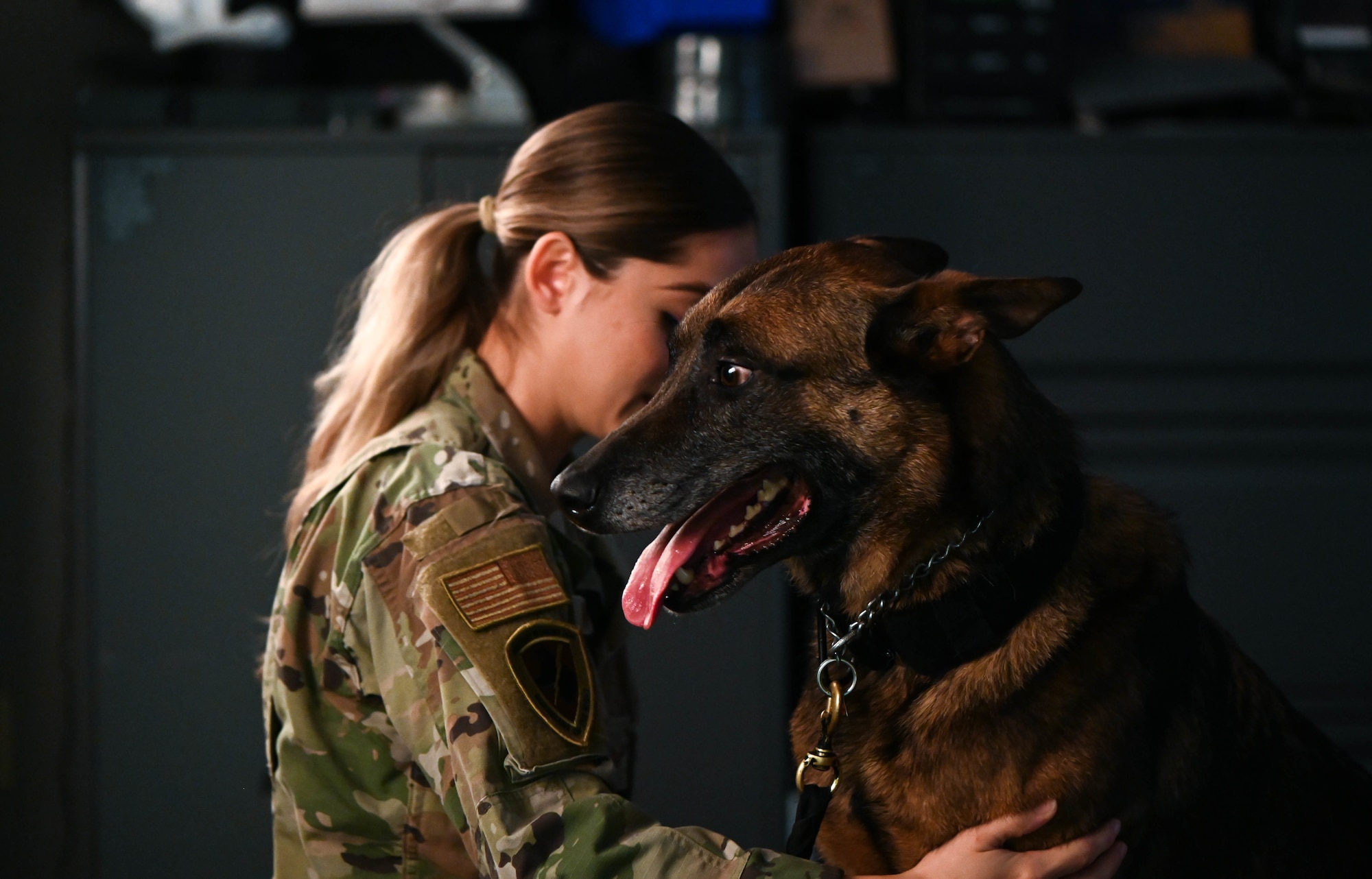 Military working dogs and their handlers from the 72nd Security Forces Squadron pose for official photos November 4, 2022, Tinker Air Force Base, Oklahoma.