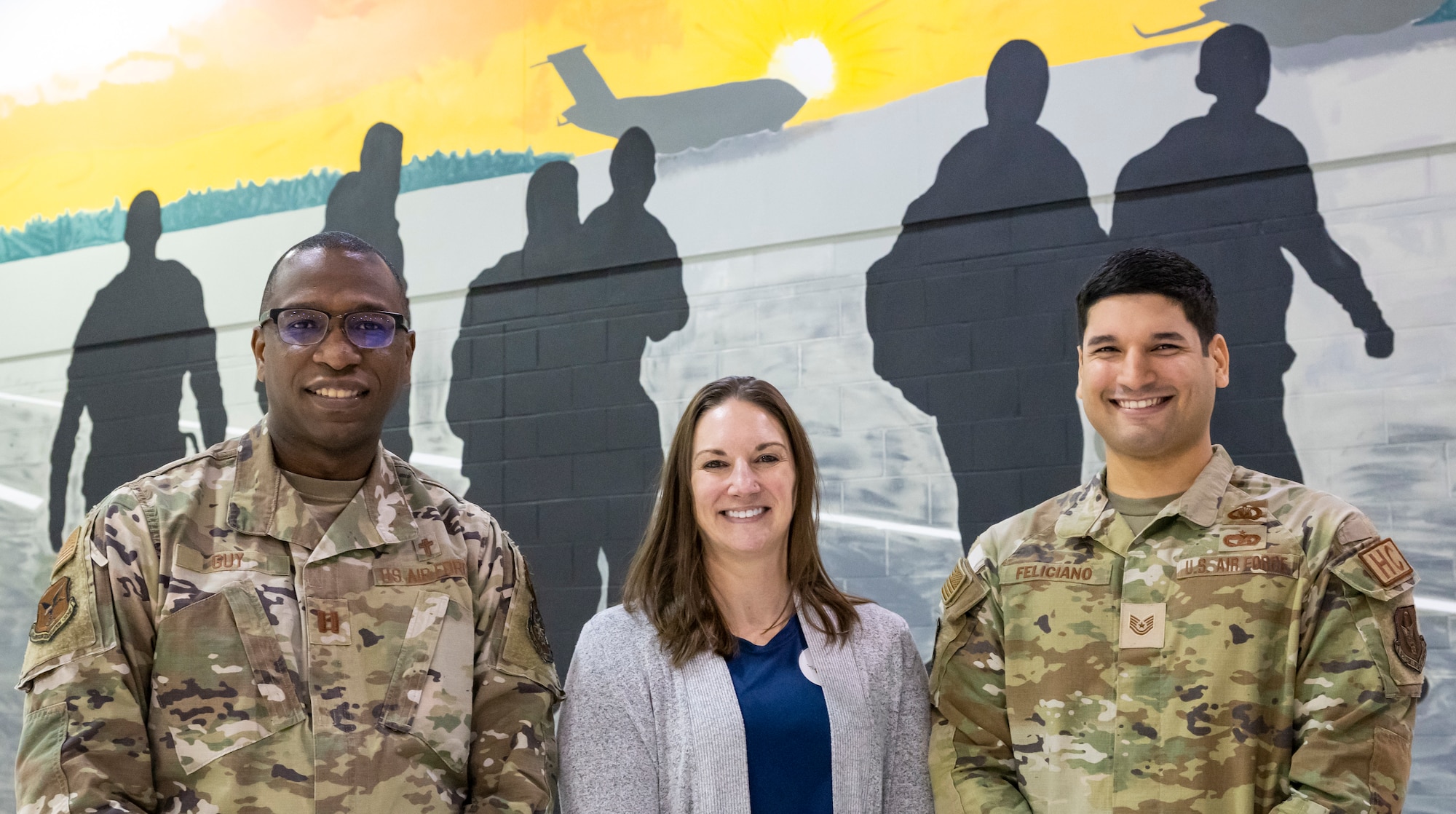 Chaplain (Capt.) William Guy, left, 436th Airlift Wing chaplain, Breanna Pelleschi, center, 436th Operational Medical Readiness Squadron licensed clinical social worker, and Tech. Sgt. Eric Feliciano, 512th AW chapel operations noncommissioned officer in charge, pose for a photo at Dover Air Force Base, Delaware, Nov. 21, 2022. Guy, Pelleschi and Feliciano make up the True North program team that will be embedding into the 436th Mission Generation Group. True North is a mental and spiritual health support program that provides tools and resources to help increase resiliency of Airmen within a unit. (U.S. Air Force photo by Senior Airman Stephani Barge)