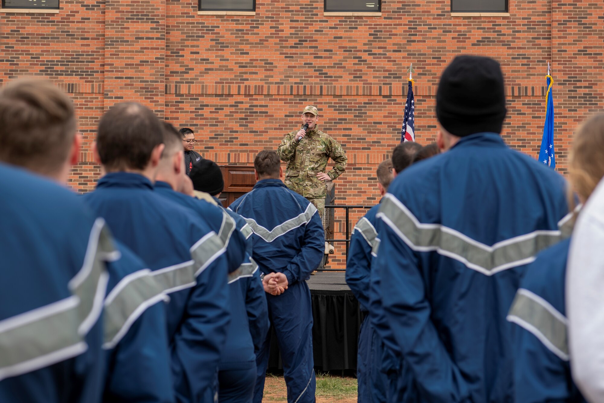 Col. Joseph Kramer, 7th Bomb Wing commander, speaks to Airmen about full spectrum resilience during sports day at Dyess Air Force Base, Texas, Nov. 18, 2022. Implementing the spectrum of resilience is a key priority for the 7th Force Support Squadron. Sports day promoted teamwork with a variety of endurance and strength building competitions. (U.S. Air Force photo by Senior Airman Mercedes Porter)