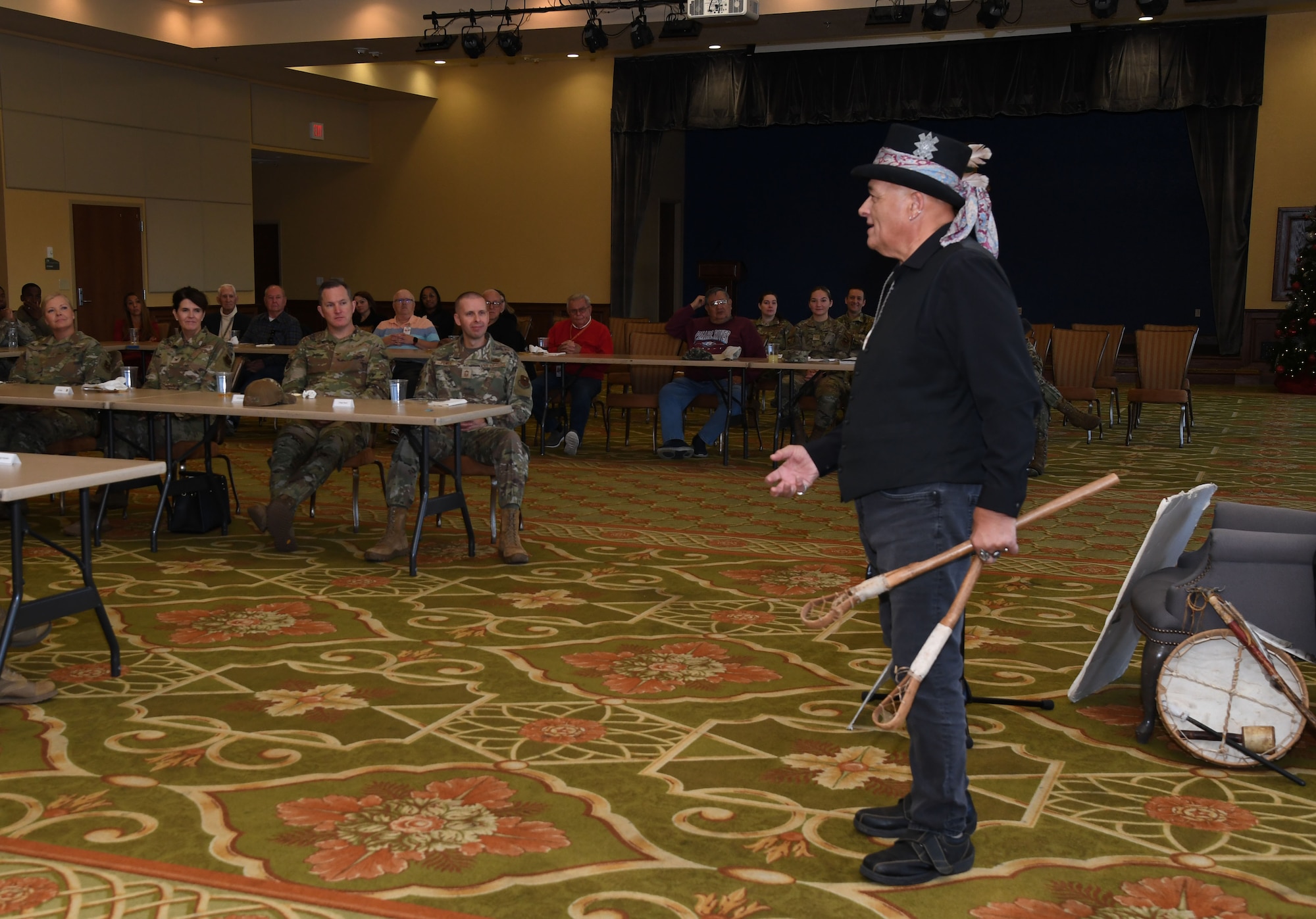 Grayhawk Perkins explains how stick ball is played to Keesler personnel inside the Bay Breeze Event Center at Keesler Air Force Base, Mississippi, Nov. 21, 2022.