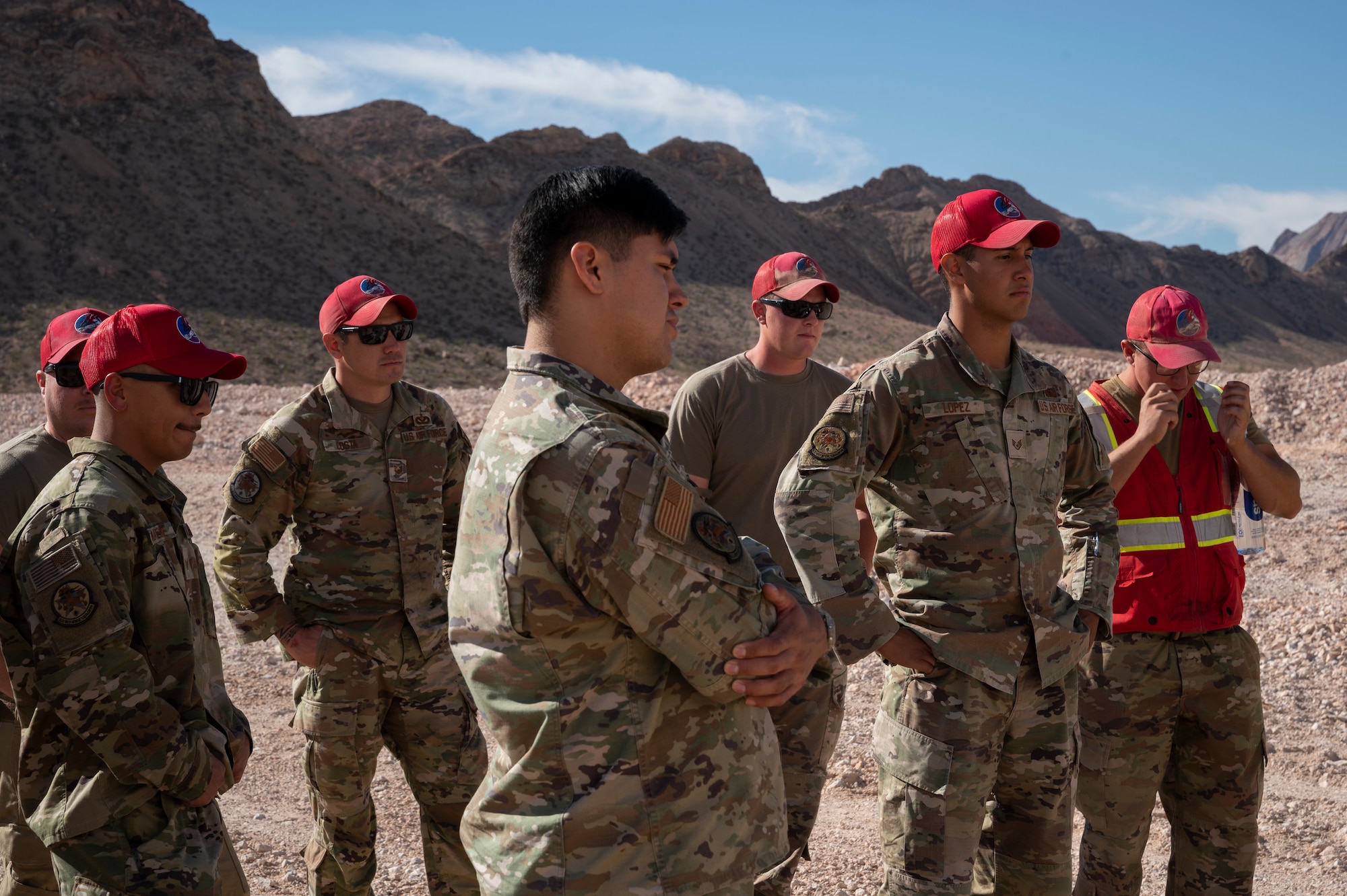 Men stand in a group