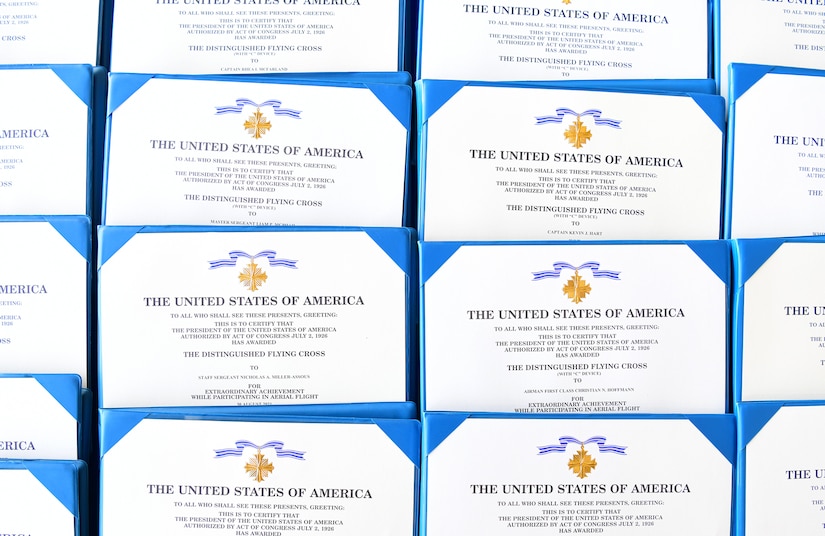 A photo of Distinguished Flying Cross certificates.