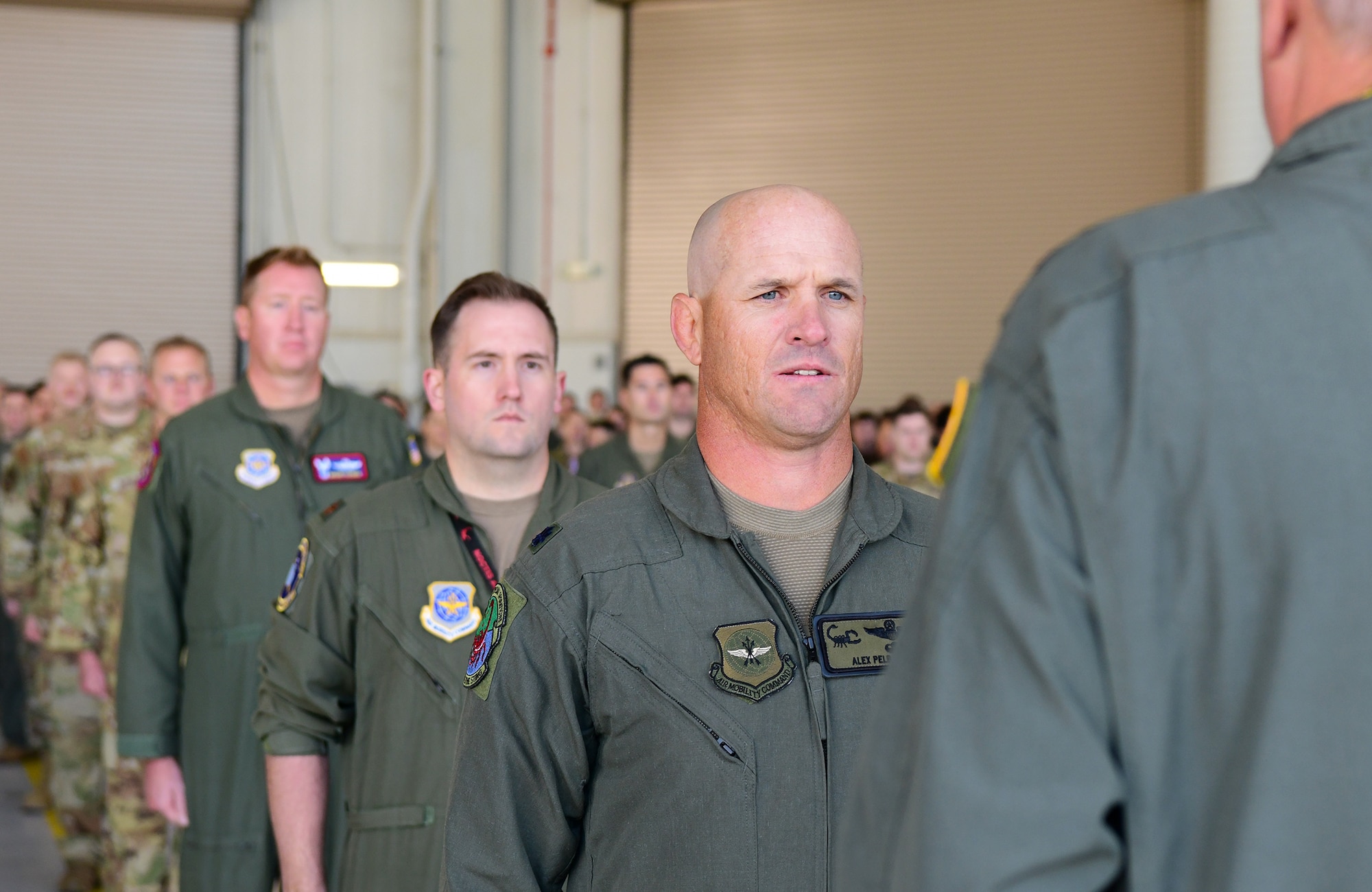 Airmen stand in formation.