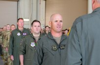 Airmen stand in formation.