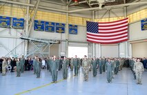 Airmen stand in formation.