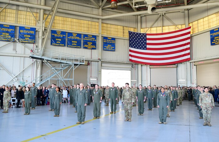 Airmen stand in formation.