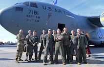 Airmen pose in a photo.