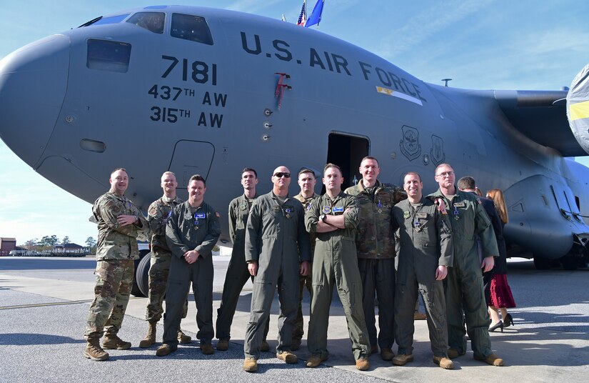 Airmen pose in a photo.