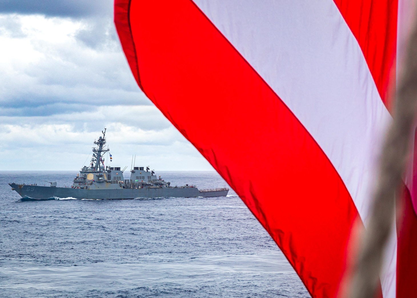 PHILIPPINE SEA (Nov. 20, 2022) USS Milius (DDG 69) sails alongside U.S., Japanese Maritime Self-defense Force and Royal Australian Navy ships as seen from USS Chancellorsville (CG 62) in the Philippine Sea, Nov. 20. Carrier Strike Group (CSG) 5 units are conducting tri-lateral operations with JS Setogiri (DD 156) of the Japan Maritime Self-Defense Force (JMSDF) and HMAS Stalwart (A304) of the Royal Australian Navy, to focus on allied interoperability training in the areas of sustainment capability and high end warfighting. Chancellorsville is forward-deployed to the U.S. 7th Fleet in support of security and stability in the Indo-Pacific and is assigned to Commander, Task Force 70, a combat-ready force that protects and defends the collective maritime interest of its allies and partners in the region. (U.S. Navy photo by Mass Communication Specialist 2nd Class Justin Stack)