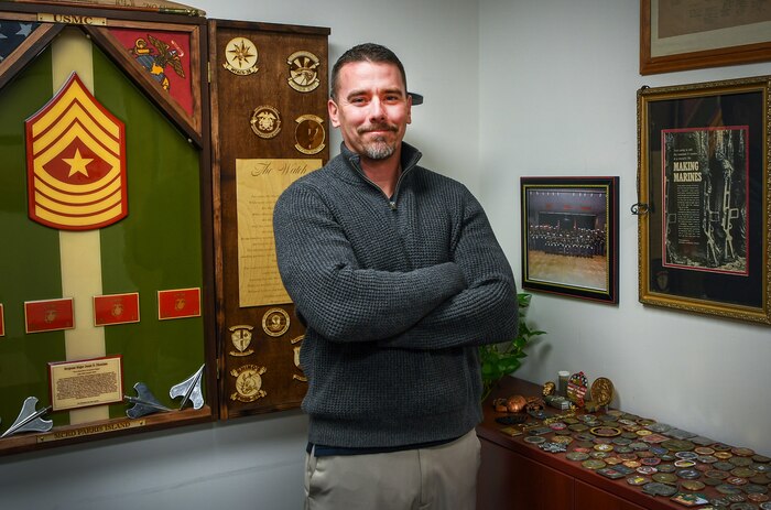 Jason DiCosimo, installation Inclusion Program manager, stands for a photo in his office at Hanscom Air Force Base, Mass., Nov. 18. DiCosimo will support the Hanscom Diversity, Equity, Inclusion and Accessibility Cell to combat harassment or personality conflicts by facilitating proactive conversation, connectedness, and cohesion in the workplace between coworkers as well as management. (U.S. Air Force photo by Lauren Russell)