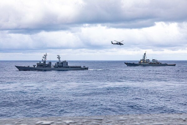 PHILIPPINE SEA (Nov. 20, 2022) USS Chancellorsville (CG 62) along with Carrier Strike Group (CSG) 5 units conduct tri-lateral operations with JS Setogiri (DD 156) of the Japan Maritime Self-Defense Force (JMSDF) and HMAS Stalwart (A304) of the Royal Australian Navy, to focus on allied interoperability training in the areas of sustainment capability and high end warfighting in the Philippine Sea, Nov. 20. Chancellorsville is forward-deployed to the U.S. 7th Fleet in support of security and stability in the Indo-Pacific and is assigned to Commander, Task Force 70, a combat-ready force that protects and defends the collective maritime interest of its allies and partners in the region. (U.S. Navy photo by Mass Communication Specialist 2nd Class Justin Stack)