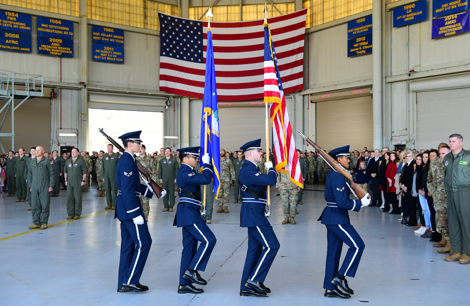 The Honor Guard marches away.