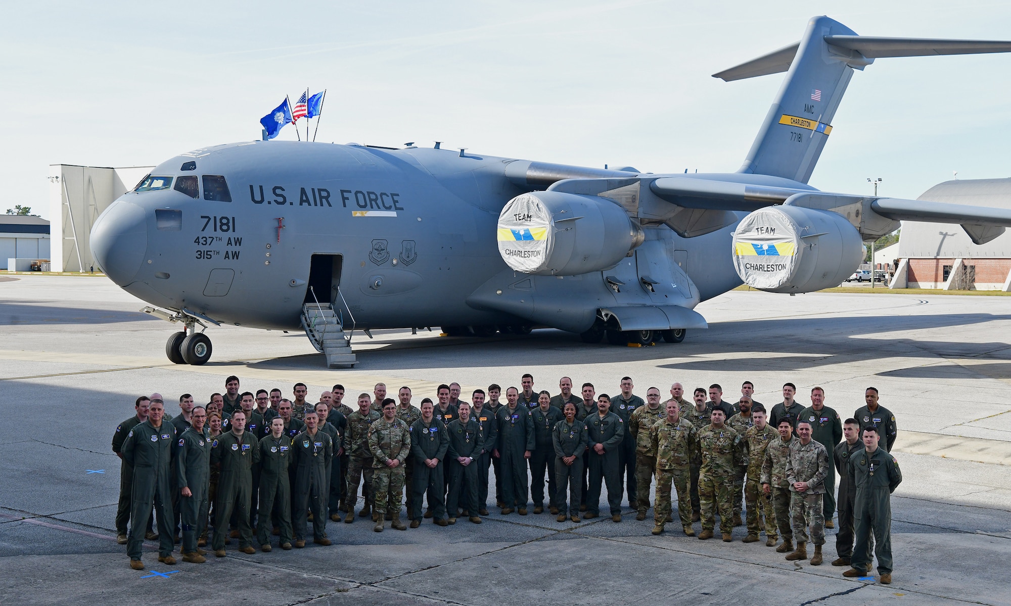 Airmen pose in a photo.