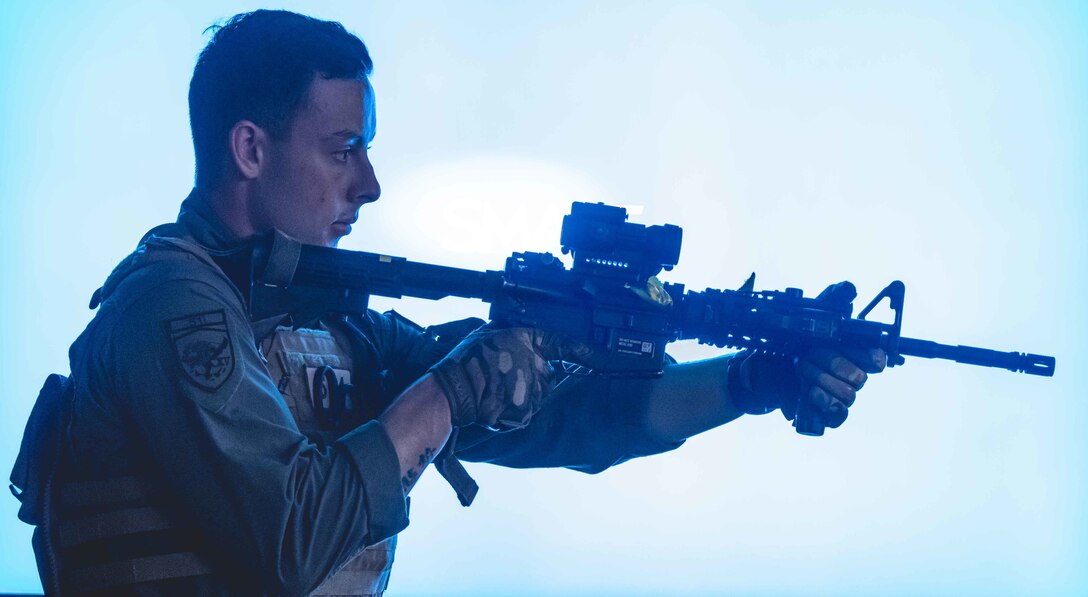 U.S. Marine Corps Sgt. Levi Smith, a military police officer with Provost Marshal’s Office, Marine Corps Installations Pacific, clears a room during a simulated bilateral search while participating in Exercise Keen Sword 2023 on Camp Foster, Okinawa, Japan, Nov. 13, 2022. Keen Sword exercises the combined command and control capabilities and lethality developed between Marine Corps Installations Pacific, III Marine Expeditionary Force, and the Japan Self-Defense Force. This bilateral field-training demonstrates the U.S. military and JSDF interoperability and combat readiness of the U.S.-Japan Alliance. (U.S. Marine Corps photo by Lance Cpl. Jonathan Beauchamp)