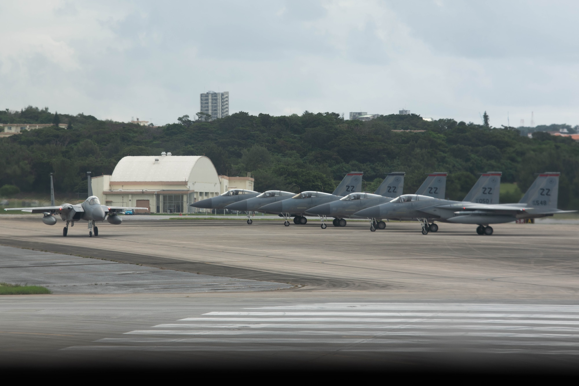 Jets taxi on a runway.