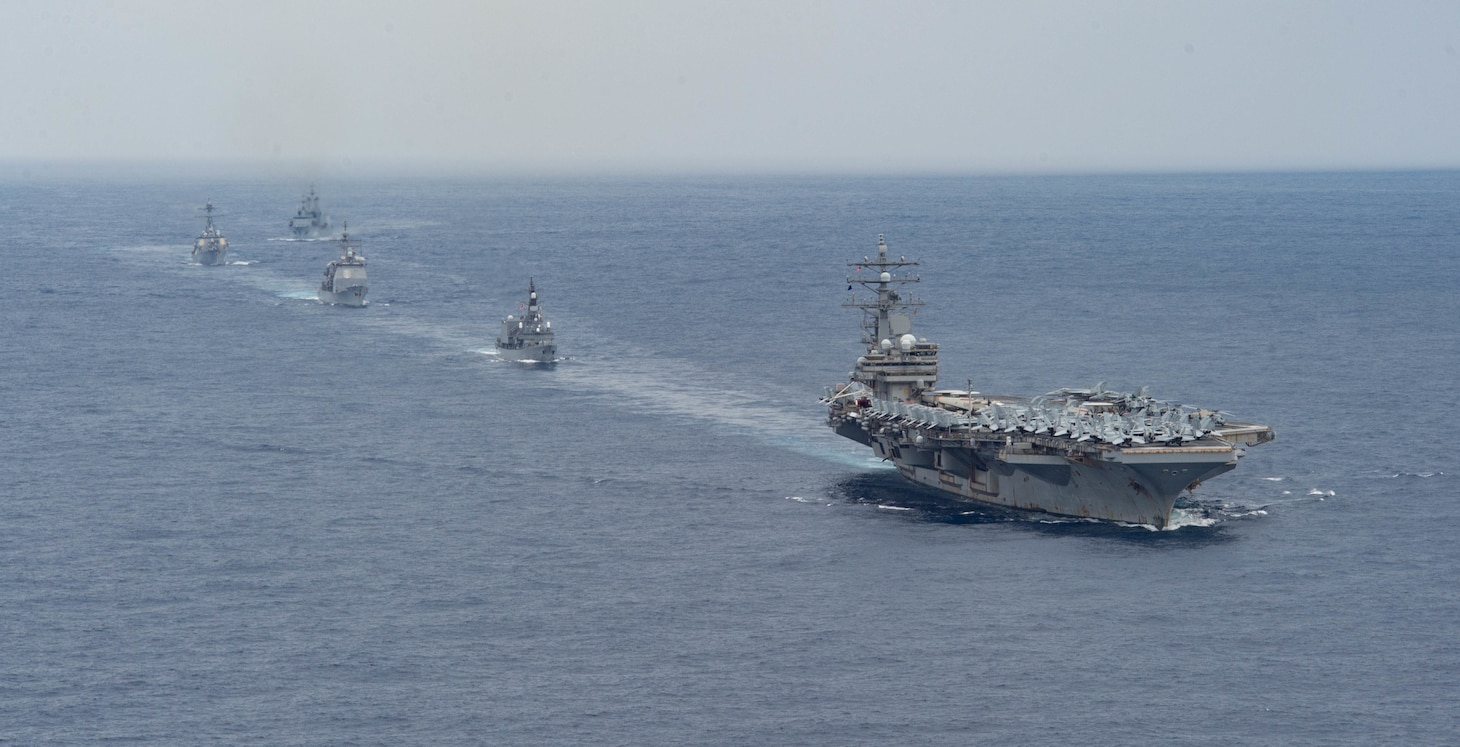 PHILIPPINE SEA (Nov. 20, 2022) The U.S. Navy’s only forward-deployed aircraft carrier, USS Ronald Reagan (CVN 76), leads a multi-national formation including Arleigh Burke-class guided-missile destroyer, USS Milius (DDG 69), Japan Maritime Self-Defense Force ship, JS Setogiri (DD 156), Ticonderoga-class guided-missile cruiser, USS Chancellorsville (CG 62), and Royal Australian Navy supply ship, HMAS Stalwart (A304), in the Philippine Sea, Nov. 20. Ronald Reagan, the flagship of Carrier Strike Group 5, provides a combat-ready force that protects and defends the United States, and supports Alliances, partnerships and collective maritime interests in the Indo-Pacific region. (U.S. Navy photo by Mass Communication Specialist 2nd Class Louis Thompson Staats IV)