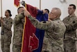 (left to right) Maj. Gen. Mark McCormack and Command Sgt. Maj. Randall Pritts, commanding general and command sergeant major, respectively, of the 28th Infantry Division, uncase the colors of the 28th ID during the Task Force Spartan transfer of authority on Nov. 20, 2022. The 28th ID took over the mission from the 35th ID (U.S. Army photo by Master Sgt. Matthew Keeler)