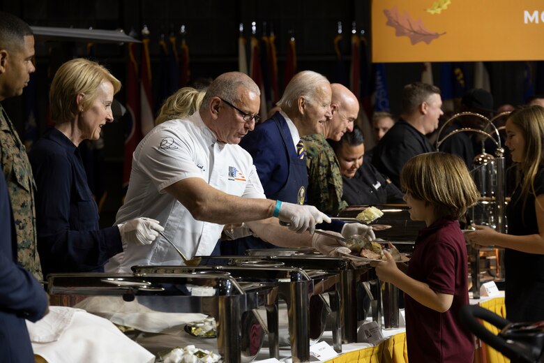 The commander in chief and first lady, alongside renowned Chef Robert Irvine, served military and families meals for Friendsgiving to recognize the sacrifices they make while serving the nation, especially during the holidays. Their visit was part of Joining Forces, a White House initiative to support military families.