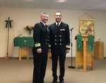 Cmdr. Mike Moreno and Lt. Cmdr. Mark Moreno pose for a photograph.