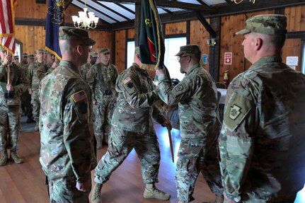 Lt. Col. Kevin Potts assumes command of the Fort Indiantown Gap National Guard Training Center, Pennsylvania Army National Guard, from Lt. Col. Andrew O’Connor at a change-of-command ceremony Nov. 19. Brig. Gen. James McCormack, assistant adjutant general-Army, presides while Command Sgt. Maj. Nicholas Lazor passes the unit colors to the outgoing commander. Fort Indiantown Gap, headquarters of the Pennsylvania National Guard, is the only live-fire, maneuver military training facility in Pennsylvania and is among the busiest National Guard Training Centers in the country. (U.S. Army National Guard photo by Sgt. 1st Class Zane Craig)
