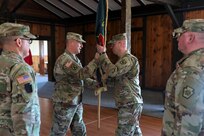 Brig. Gen. James McCormack, assistant adjutant general-Army, passes the colors to incoming commander Lt. Col. Kevin Potts during a change-of-command ceremony for the Fort Indiantown Gap National Guard Training Center, Nov. 19, 2022. Potts assumed command from Lt. Col. Andrew O’Connor. (U.S. Army National Guard photo by Sgt. 1st Class Zane Craig)