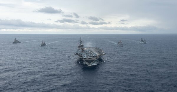 PHILIPPINE SEA (Nov. 20, 2022) The U.S. Navy’s only forward-deployed aircraft carrier, USS Ronald Reagan (CVN 76), steams in formation with Arleigh Burke-class guided-missile destroyer, USS Milius (DDG 69), Japan Maritime Self-Defense Force ship, JS Setogiri (DD 156), Ticonderoga-class guided-missile cruiser, USS Chancellorsville (CG 62) and Royal Australian Navy supply ship, HMAS Stalwart (A304), in the Philippine Sea, Nov. 20. Ronald Reagan, the flagship of Carrier Strike Group 5, provides a combat-ready force that protects and defends the United States, and supports Alliances, partnerships and collective maritime interests in the Indo-Pacific region. (U.S. Navy photo by Mass Communication Specialist 2nd Class Louis Thompson Staats IV)