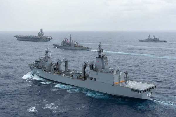 PHILIPPINE SEA (Nov. 20, 2022) The U.S. Navy’s only forward-deployed aircraft carrier, USS Ronald Reagan (CVN 76), steams in formation with Royal Australian Navy supply ship, HMAS Stalwart (A304), Ticonderoga-class guided-missile cruiser, USS Chancellorsville (CG 62) and Japan Maritime Self-Defense Force ship, JS Setogiri (DD 156), in the Philippine Sea, Nov. 20. Ronald Reagan, the flagship of Carrier Strike Group 5, provides a combat-ready force that protects and defends the United States, and supports Alliances, partnerships and collective maritime interests in the Indo-Pacific region. (U.S. Navy photo by Mass Communication Specialist 2nd Class Louis Thompson Staats IV)