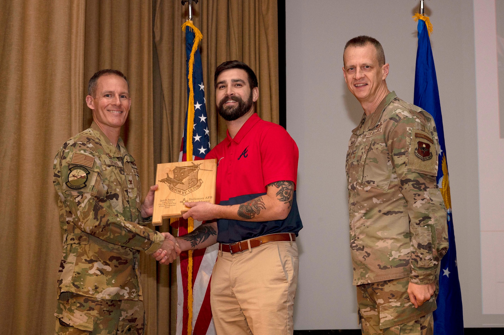 Jacob Freeman, from the 49th Contracting Squadron, accepts the Civilian Category II (Non-supervisory) of the Quarter Award, during the 49th Wing’s 3rd Quarter Award ceremony at Holloman Air Force Base, New Mexico, Nov. 21, 2022.