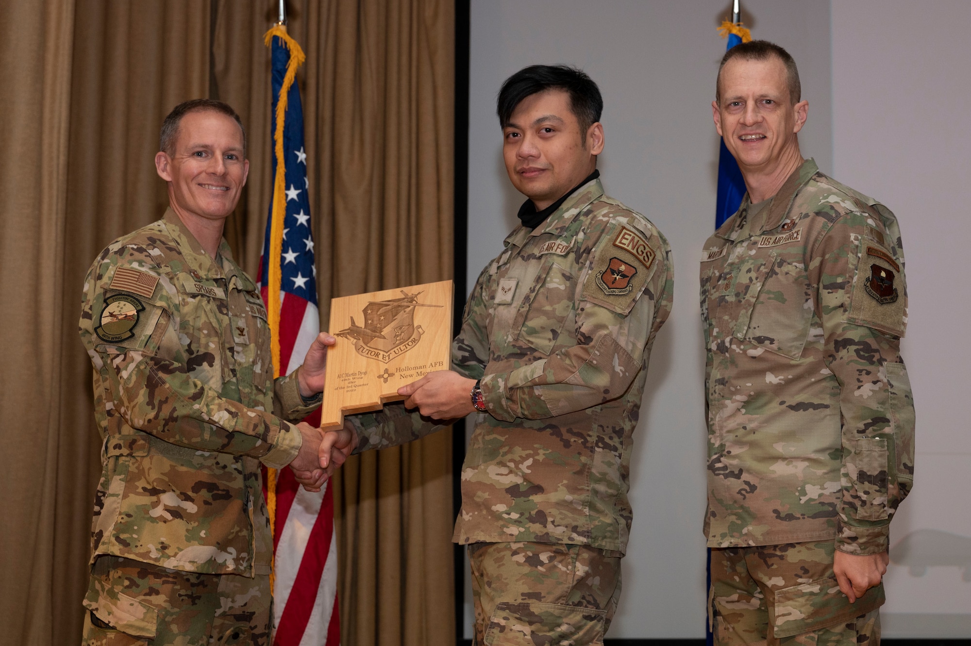 U.S. Air Force Airman 1st Class Martin Dyogi, from the 49th Component Maintenance Squadron, accepts the 49er of the Quarter Award, during the 49th Wing’s 3rd Quarter Award ceremony at Holloman Air Force Base, New Mexico, Nov. 21, 2022.