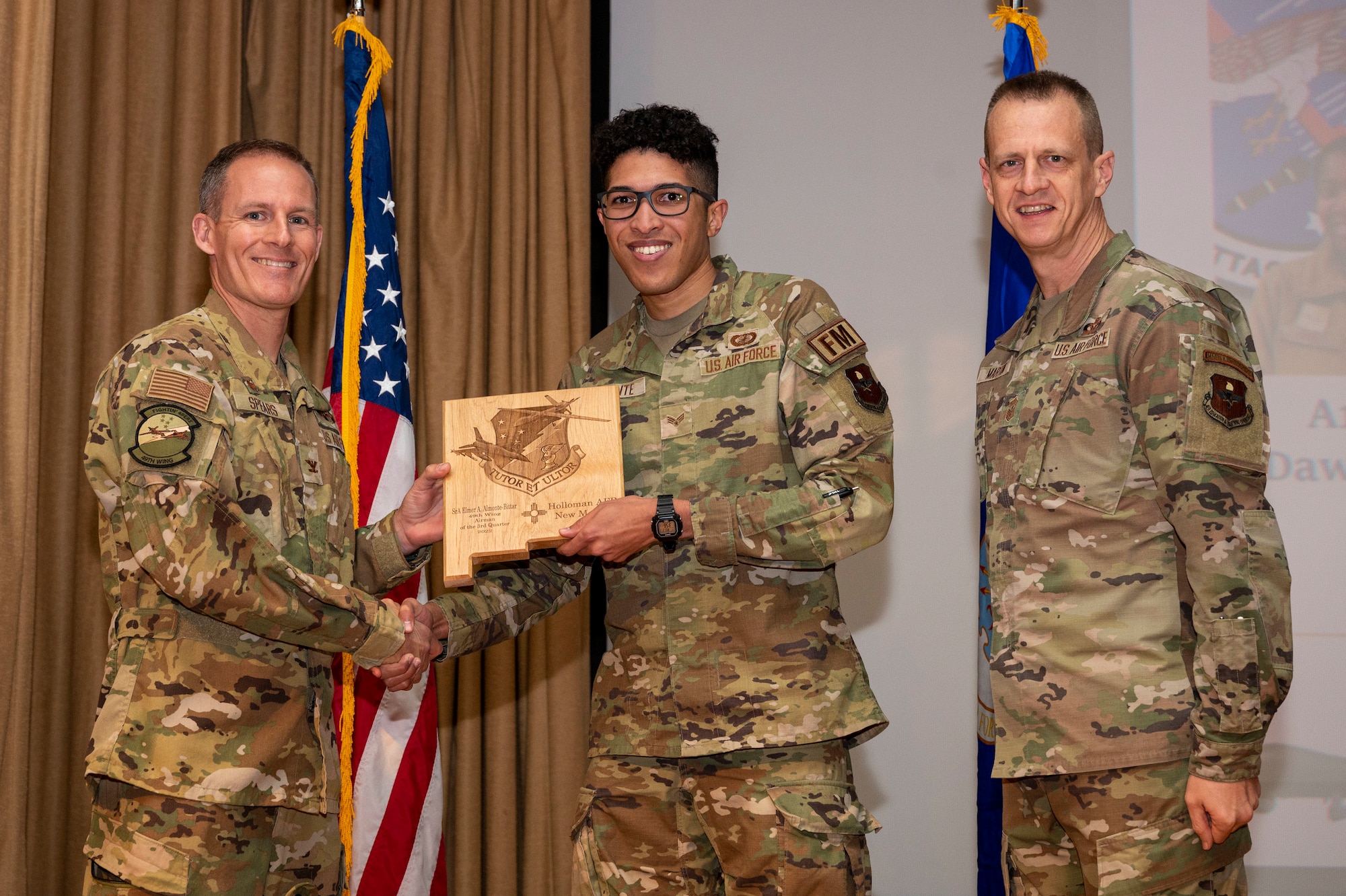 U.S. Air Force Senior Airman Elmer Almonte-Bittar, from the 49th Comptroller Squadron accepts the Airman of the Quarter Award, during the 49th Wing’s 3rd Quarter Award ceremony at Holloman Air Force Base, New Mexico, Nov. 21, 2022.