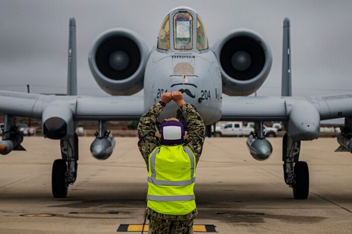 Navy seaman taxis in A-10.