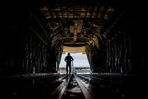 Airman walks out of plane.